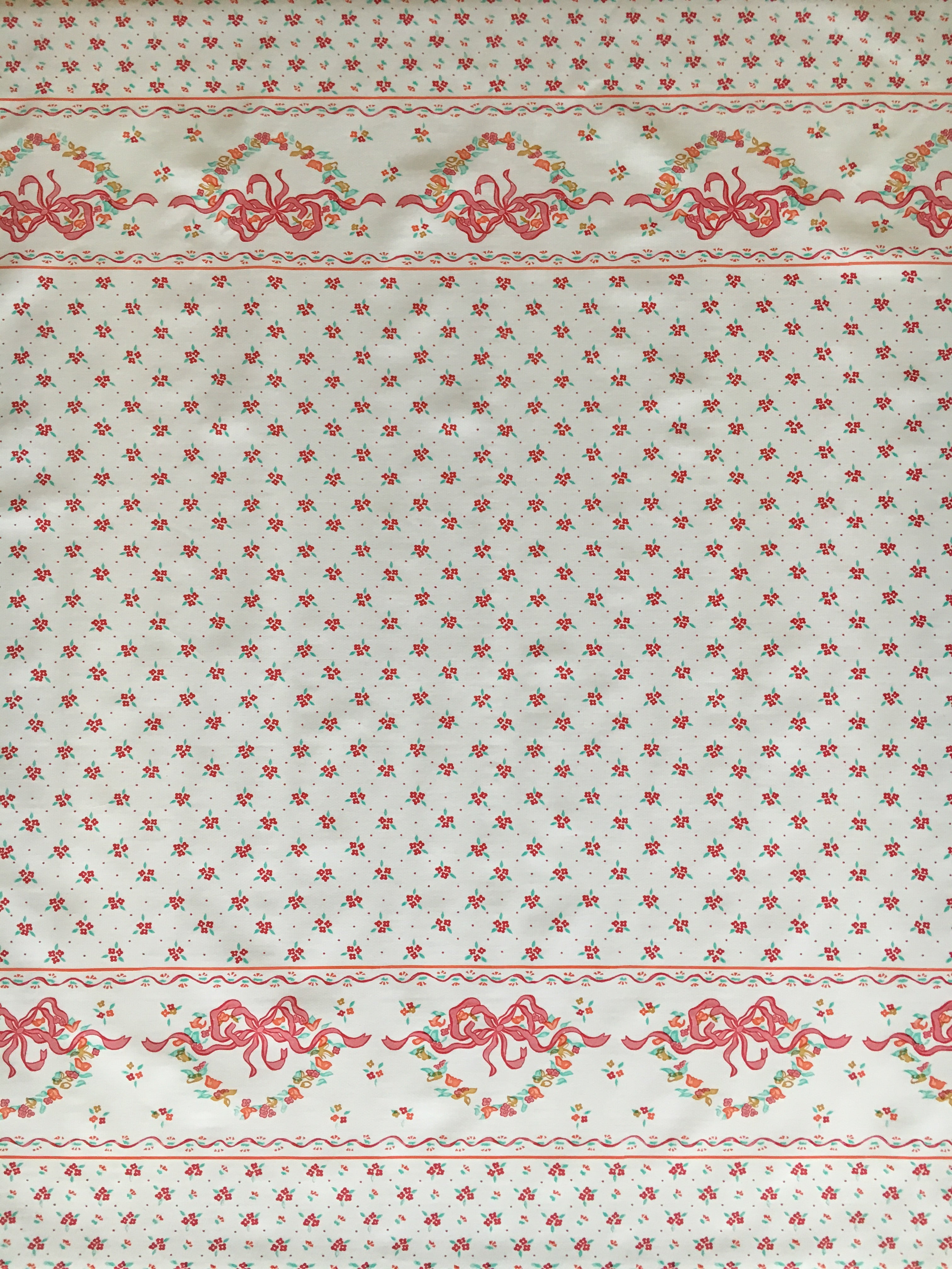 Red Ribbons & Flowers on white oilcloth fabric